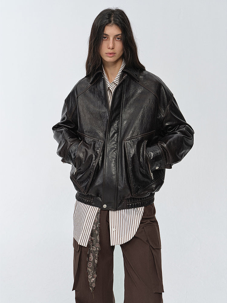 "New York Student" oversized black waxed leather bomber with drop shoulders — close-up front view