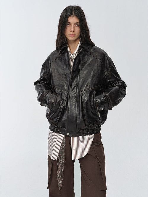 "New York Student" oversized black waxed leather bomber with drop shoulders — close-up front view