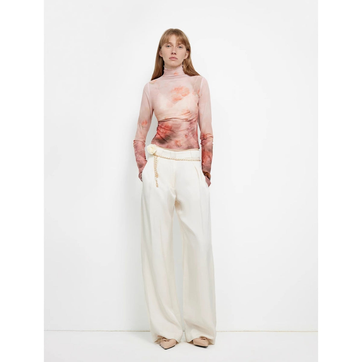 "Relaxed Old Money" off-white draped wide-leg pants styled with a pink top, full-length front view