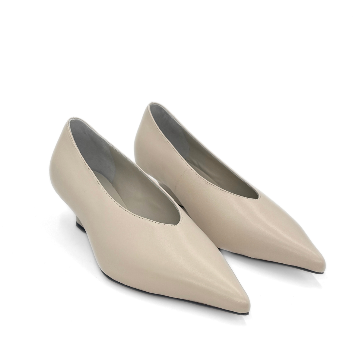 JoJo Leather Wedge Pumps in bone — pair, angled view