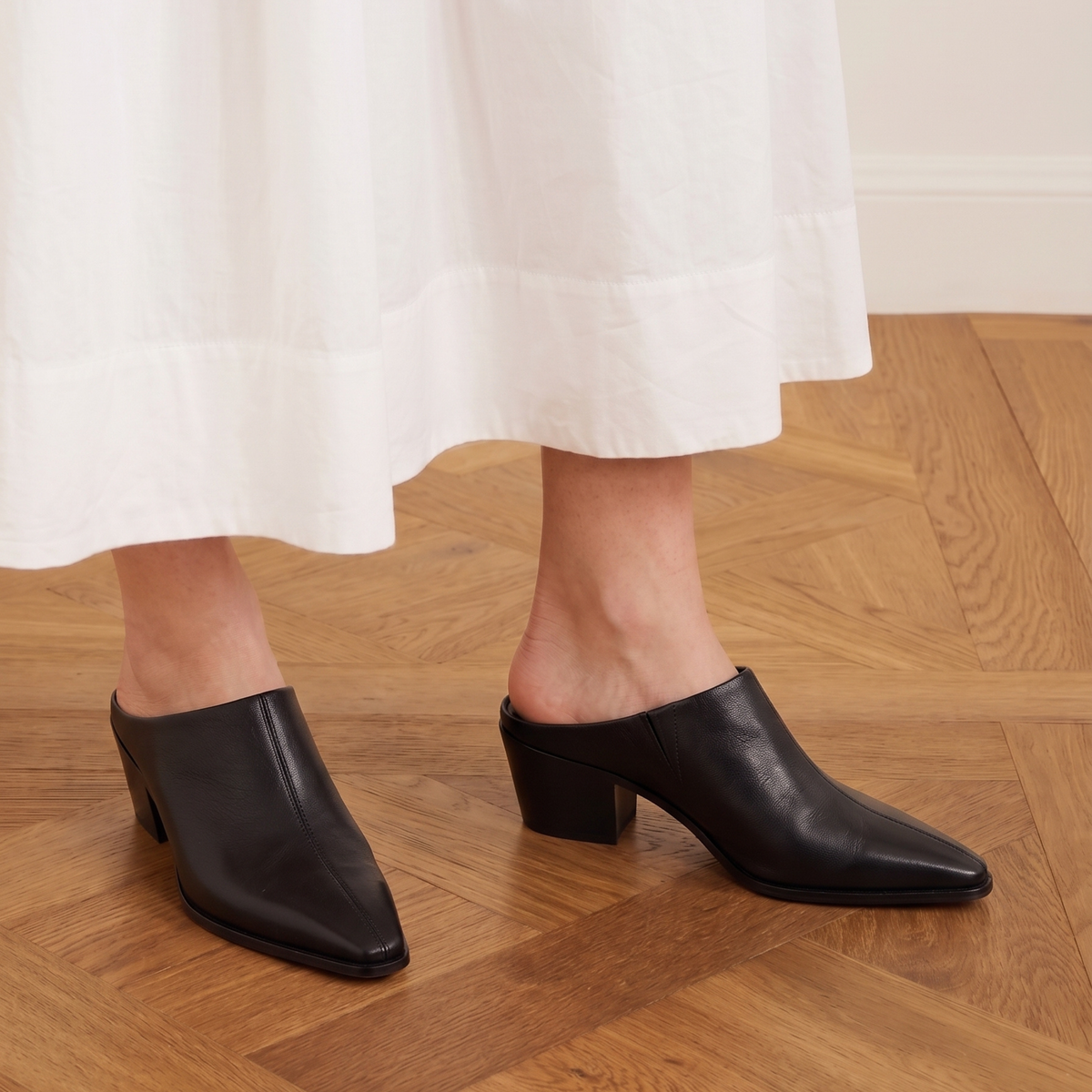 Carla Leather Western Mules in black — styled on model