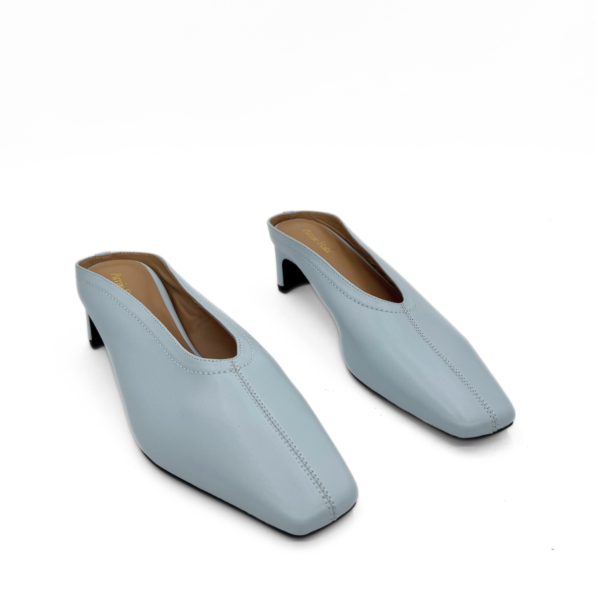 Junie Heeled Leather Mule in blue — pair, angled view
