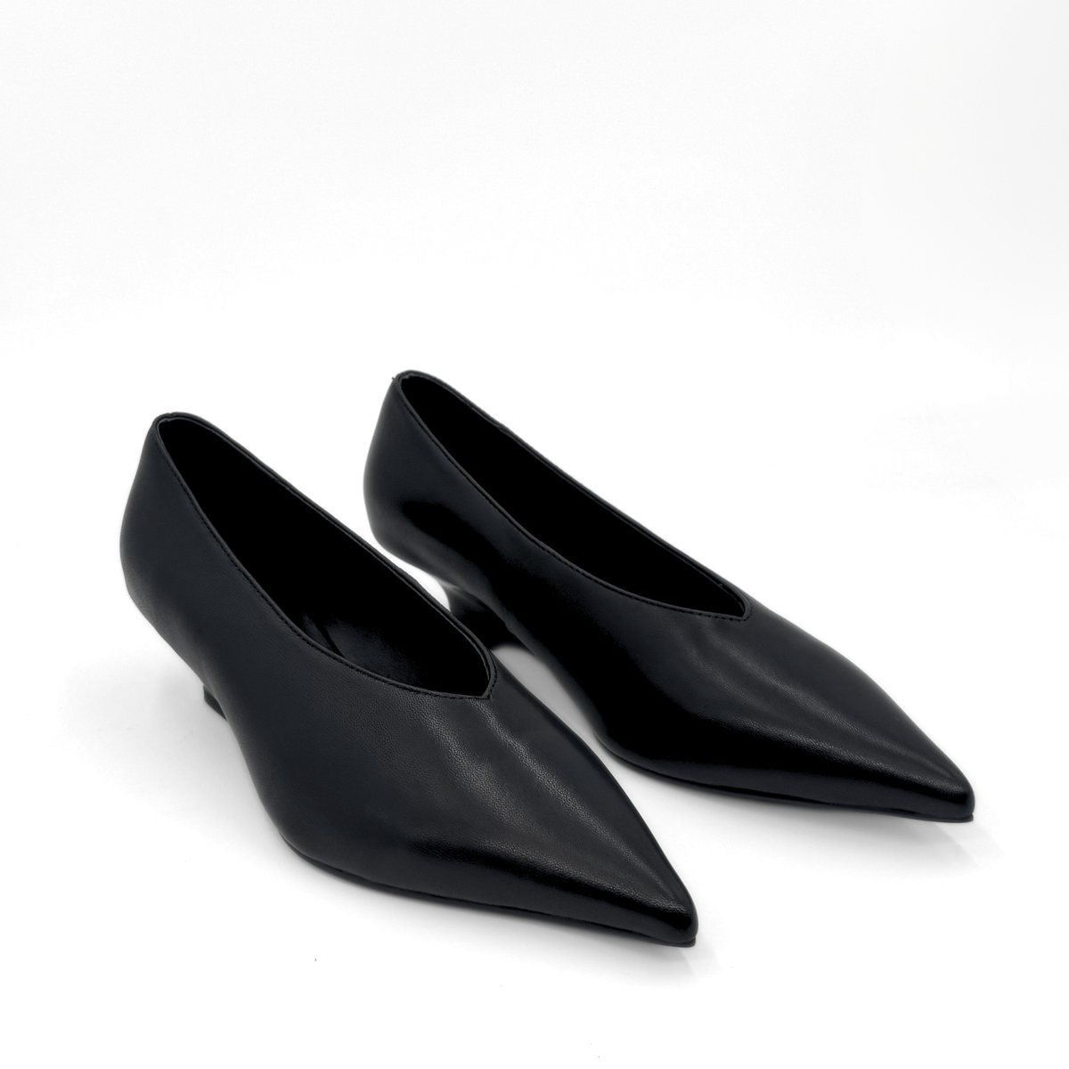 JoJo Leather Wedge Pumps in black — pair, angled view