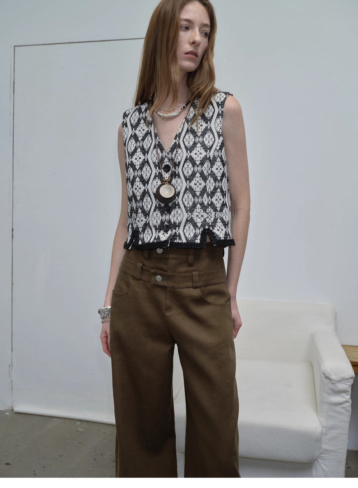 "Venice" black and white jacquard V-neck vest, studio portrait