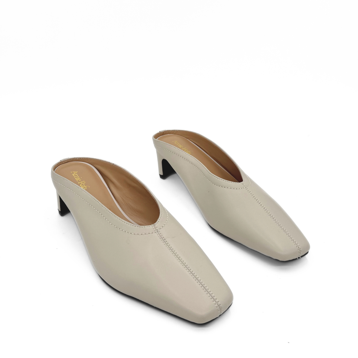 Junie Heeled Leather Mule in bone — pair, angled view