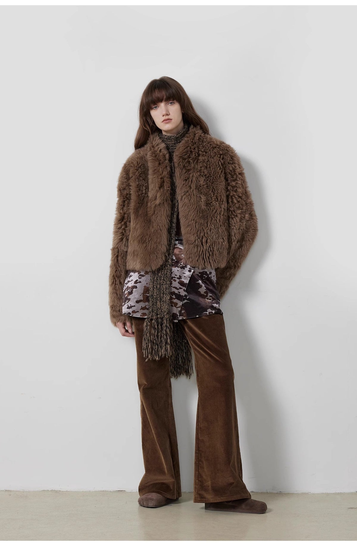 "Seaside Café" dark brown flared corduroy pants styled with a shaggy brown fur coat — full-length view