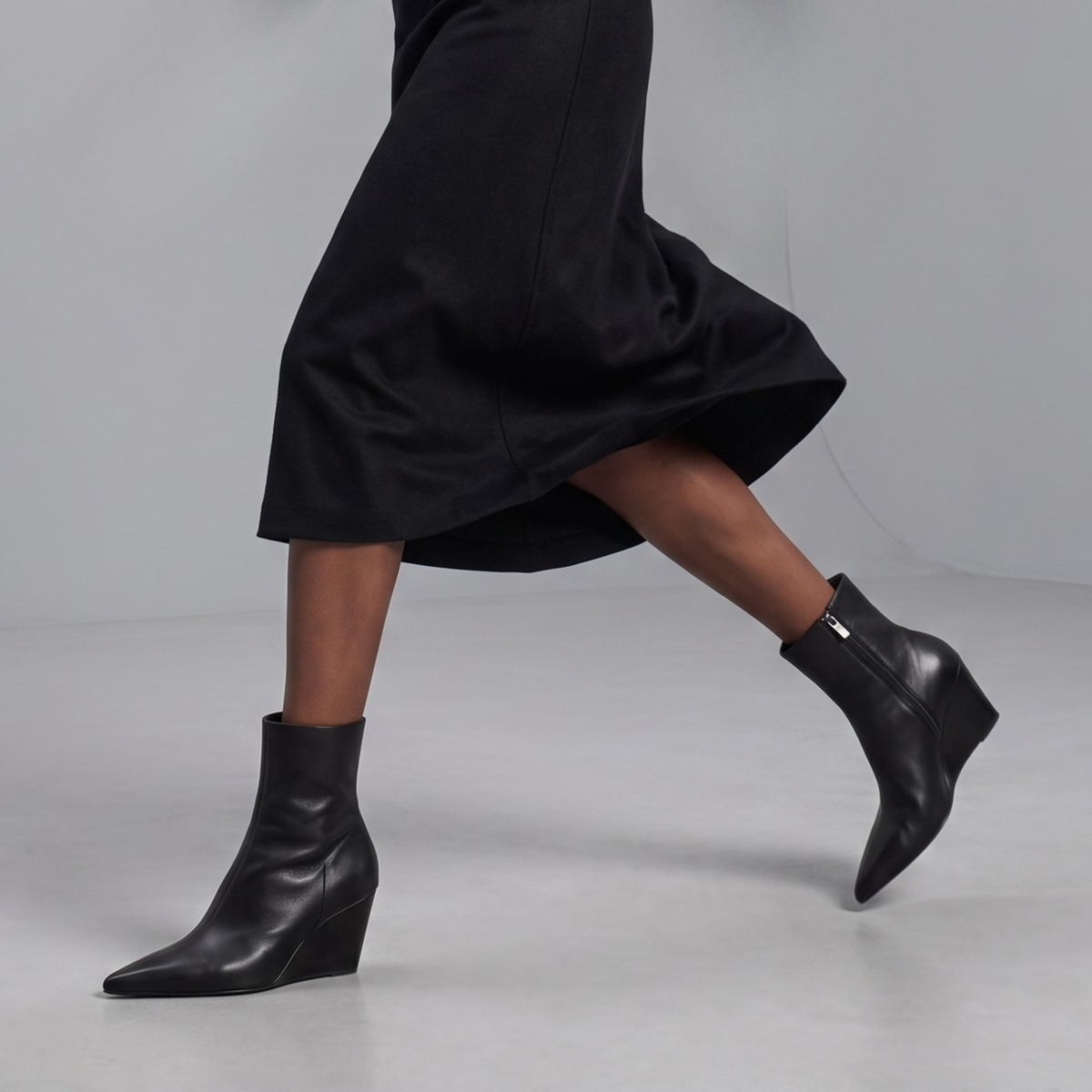 Jody Leather Wedge Boots in black — styled on model