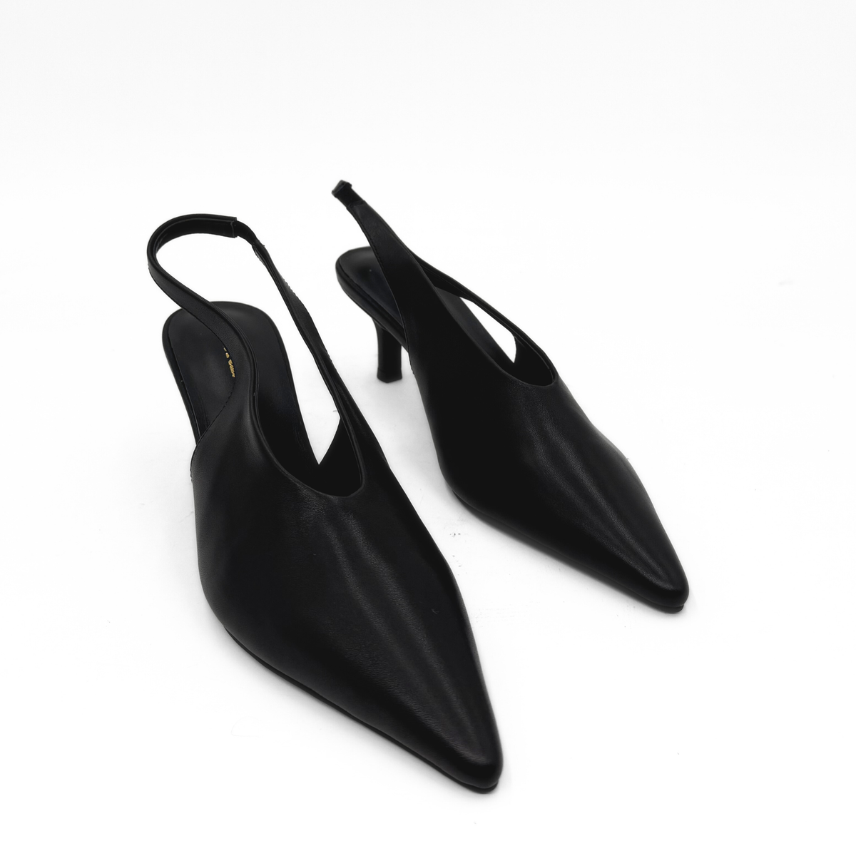 Alix Slingback Pumps in black — styled on model