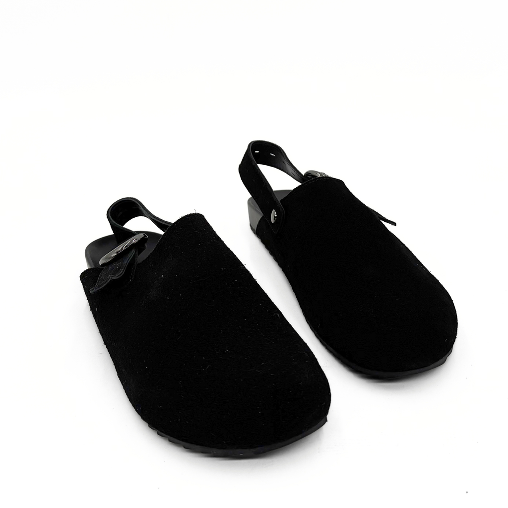 Toni Suede Clogs in black — pair, angled view