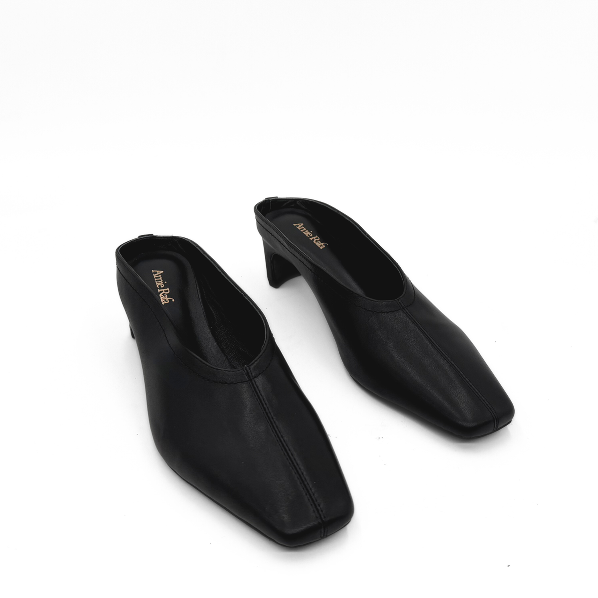 Junie Heeled Leather Mule in black — pair, angled view
