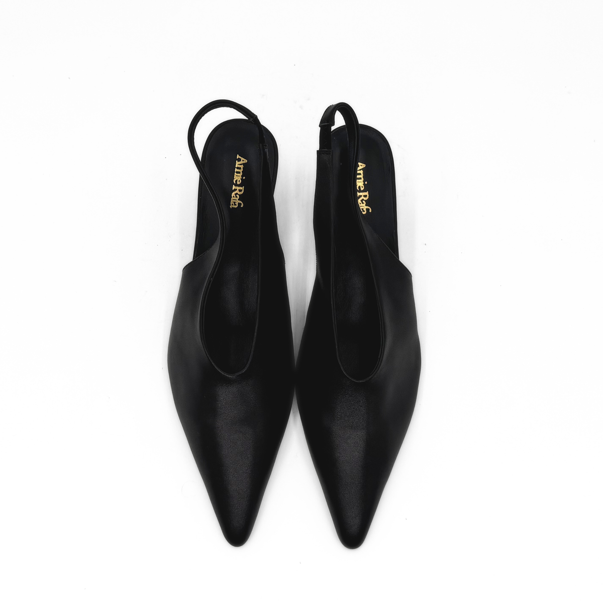 Alix Slingback Pumps in black — pair, angled view
