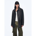"Rembrandt Night" black woven leather jacket over a white tank top, front view