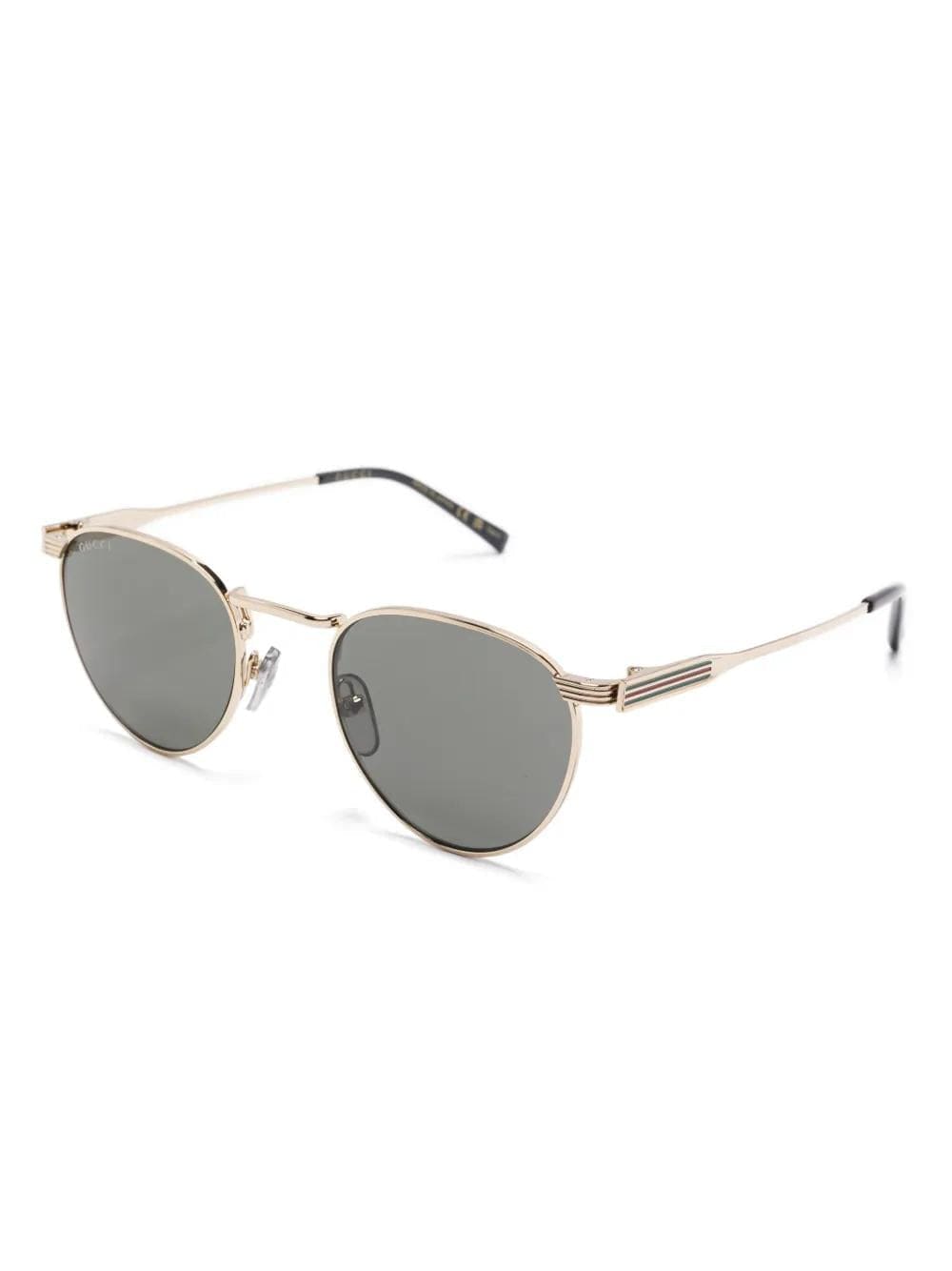 Gucci GG1875S Gold Oval Metal Sunglasses — angled front view