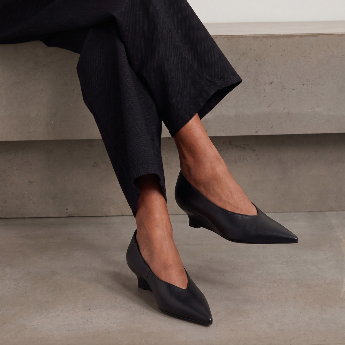 JoJo Leather Wedge Pumps in black — styled on model
