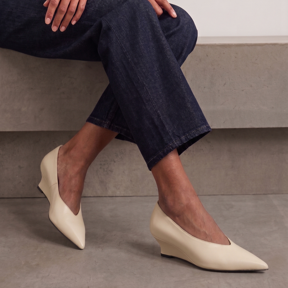 JoJo Leather Wedge Pumps in bone — styled on model